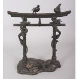 A JAPANESE MEIJI PERIOD BRONZE MODEL OF A TEMPLE TORII, its supports encircled by two dragons and