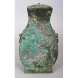 A GOOD CHINESE RITUAL BRONZE HU VASE & COVER, possibly Han Dynasty, with animal mask and loose