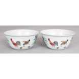 A PAIR OF CHINESE MING STYLE DOUCAI PORCELAIN CHICKEN CUPS, each base with a six-character