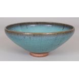 A CHINESE JUN WARE PURPLE SPLASH STONEWARE BOWL, the glaze falling short of the foot, 7.25in