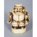 A GOOD JAPANESE EDO PERIOD IVORY SEAL NETSUKE OF DAIKOKU, standing with cheerful expression and with