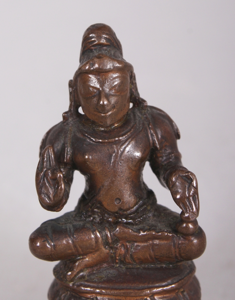 A Bronze Figure of a Tamil Saint, South India, 19th century, the bearded figure seated in - Image 5 of 8