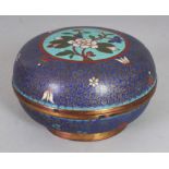 AN EARLY 20TH CENTURY CHINESE CLOISONNE CIRCULAR BOX & COVER, 4.75in diameter & 2.8in high overall.