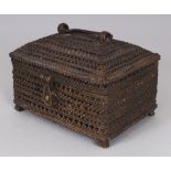 A 20TH CENTURY INDIAN PIERCED BRONZE CASKET, with a hinged cover, 6in x 5in x 4.5in high.