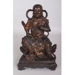 A GOOD CHINESE MING DYNASTY GILT & LACQUERED BRONZE FIGURE OF ZHENWU, seated on a low throne, one