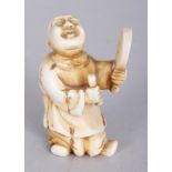 A SIGNED JAPANESE MEIJI PERIOD IVORY NETSUKE OF A STANDING BOY, with uplifted face and holding a