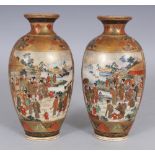 A PAIR OF EARLY 20TH CENTURY JAPANESE OVAL SECTION SATSUMA EARTHENWARE VASES, each painted with