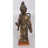 A CHINESE ARCHAIC STYLE GILT BRONZE FIGURE OF A STANDING FEMALE MUSICIAN, together with a wood