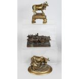 Three Indian Cast Brass Groups, Early 20th century, comprising a dairyman attending to his cow, a