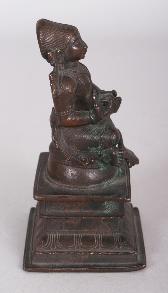 A Bronze Figure of a Tamil Saint, South India, 18th/19th century, seated in sattvasana on a raised - Image 2 of 8