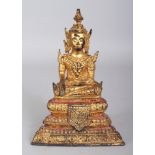 A 19TH/20TH CENTURY THAI GILT & LACQUERED BRONZE BUDDHIST FIGURE, seated on a stepped triangular