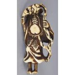 A GOOD JAPANESE EDO PERIOD IVORY NETSUKE OF A STANDING SENNIN, clasping his beard and holding a