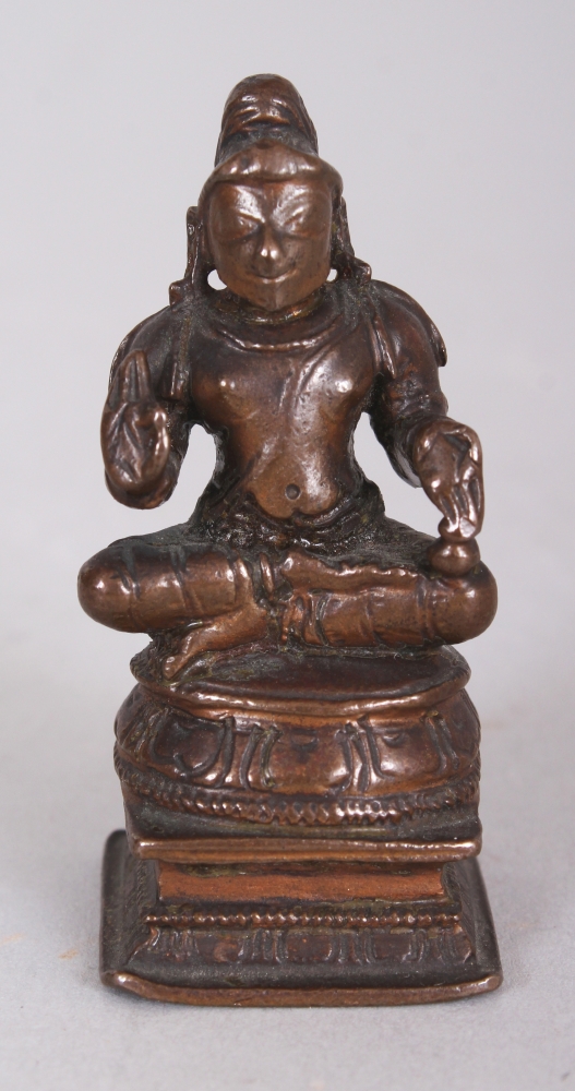 A Bronze Figure of a Tamil Saint, South India, 19th century, the bearded figure seated in