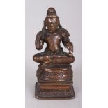 A Bronze Figure of a Tamil Saint, South India, 19th century, the bearded figure seated in