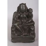 A Grey-Green Steatite Figure of Hariti, Kashmir, 8th/9th century, the goddess seated on a lion