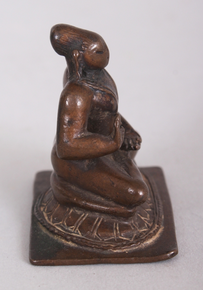 A Small Bronze Figure of a Tamil Saint, South India, 18th/19th century, seated in sattvasana, his - Image 2 of 7