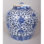 A LARGE 19TH CENTURY CHINESE BLUE & WHITE PORCELAIN JAR & COVER, painted with a design of formal