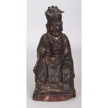 A GOOD CHINESE MING DYNASTY BRONZE FIGURE OF A SEATED OFFICIAL, with lotus engraved robes and