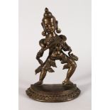 A Bronze Figure of a Male Deity, Nepal, 20th century, stepping to his left on a semi-circular