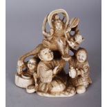 A GOOD QUALITY SIGNED JAPANESE MEIJI PERIOD IVORY OKIMONO OF A GROUP OF KNEELING BOYS, in the
