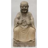 A GOOD QUALITY LARGE CHINESE STONE CARVING OF A LOHAN, 19th/20th Century or earlier, seated with