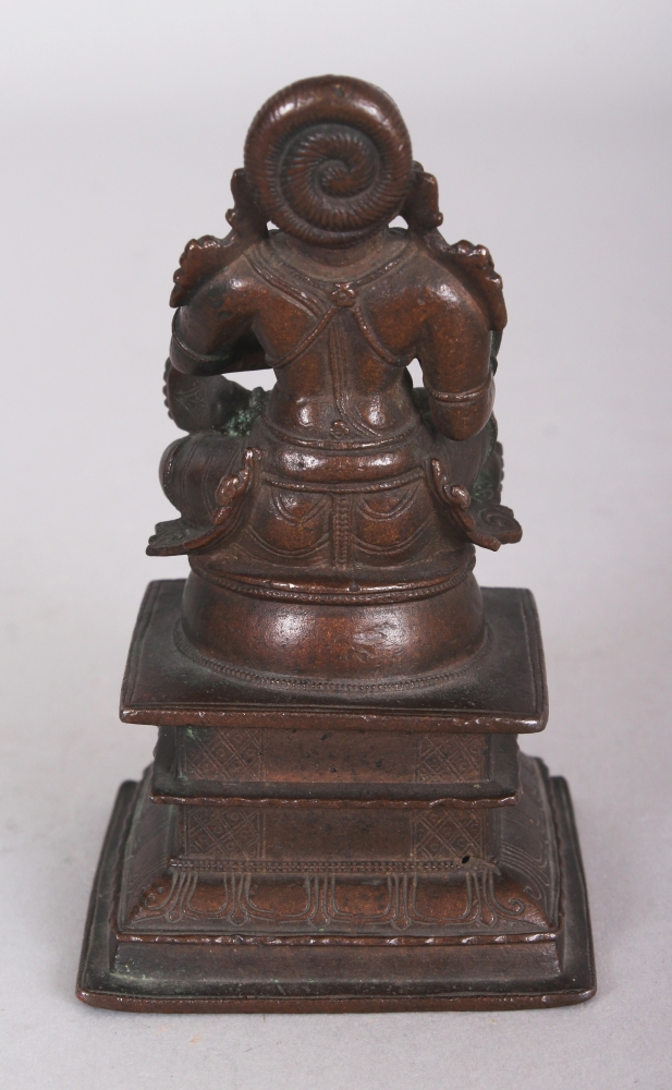 A Bronze Figure of a Tamil Saint, South India, 18th/19th century, seated in sattvasana on a raised - Image 3 of 8