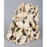 A GOOD SIGNED JAPANESE MEIJI PERIOD IVORY OKIMONO OF A LARGE GROUP OF TOADS, clambering over each