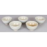 A SET OF FIVE SMALL 20TH CENTURY JAPANESE CELADON GLAZED CERAMIC BOWLS, together with a fitted