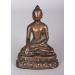 A Bronze Figure of Buddha, Tibet, circa 16th century, seated in padmasana on a double lotus