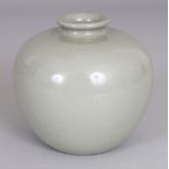 A SMALL CHINESE CELADON GLAZED PORCELAIN JAR, the base with a Qianlong seal mark, 3.5in wide at