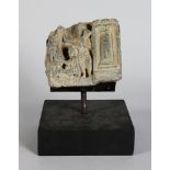 A Small Gandhara Style Grey Schist Relief Fragment, North-Western India (now Pakistan), depicting