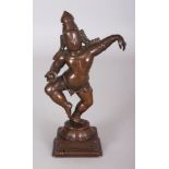 A Bronze Figure of Krishna, Tamil Nadu, South India, 17th/18th century, dancing on a lotus on square