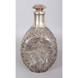 AN EARLY 20TH CENTURY CHINESE SILVER-METAL OVERLAID DIMPLE HAIG FORM GLASS DECANTER & STOPPER, the