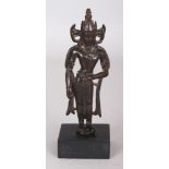 A Small Bronze Crowned Figure of Buddha, Kashmir, 11th/12th century, the slender figure standing