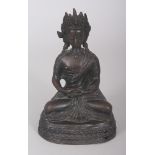 A 19TH CENTURY NEPALESE BRONZE FIGURE OF BUDDHA, seated in dhyanasana on a lotus plinth, his hands