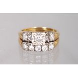 AN UNUSUAL 14K YELLOW GOLD AND DIAMOND SET DOUBLE ROW RING.