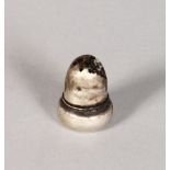 A MINIATURE SILVER ACORN PEPPER POT.