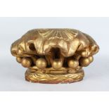 A LATE 19TH CENTURY CARVED AND GILDED WOOD PILLAR CAPITAL OR WALL BRACKET. 1ft 2ins wide.