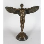ADOLF WEINMAN (1870-1952) AMERICAN A BRONZE SCULPTURE OF A WINGED MAN, on a circular base, signed