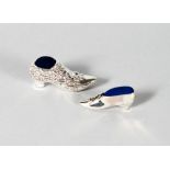 TWO NOVELTY SILVER SHOE PIN CUSHIONS.