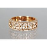 AN 18CT ROSE GOLD HALF ETERNITY RING of 75 points.