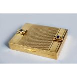 A GOOD ART DECO DESIGN GOLD COMPACT, with engine turned decoration, set with four sapphires. stamped
