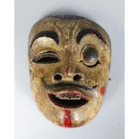 A POLYCHROME CARVED WOODEN DANCE MASK (TOPENG) of Kebo Sepati Bali or Lombok, Indonesia, finely