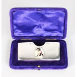 A SILVER CARD CASE, Chester 1901, the lid with a cat.