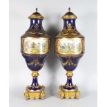 A SUPERB PAIR OF 19TH CENTURY SEVRES PORCELAIN VASES AND COVERS, painted with hunting scenes on both
