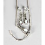A SILVER OPAL SNAKE NECKLACE AND EARRINGS.