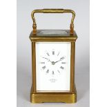 A 19TH CENTURY FRENCH BRASS CARRIAGE CLOCK striking on a gong, Retailed by LUND & BLOCKLEY, 42