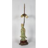 A CHINESE CARVED GREEN QUARTZ FIGURE OF GUANYIN as a lamp.