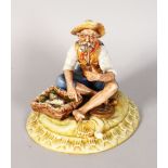 A CAPODIMONTE PORCELAIN GROUP, old man smoking a pipe, basket of fish by his side. 7ins high.