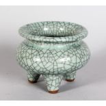 A CHINESE CRACKLE GLAZED CENSOR, on three legs. 4.5ins diameter.